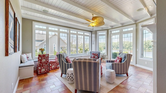 830 Prairie Island Rd N, Winona, MN 55987 - sunroom / solarium with french doors, stone tile floors, and beamed ceiling