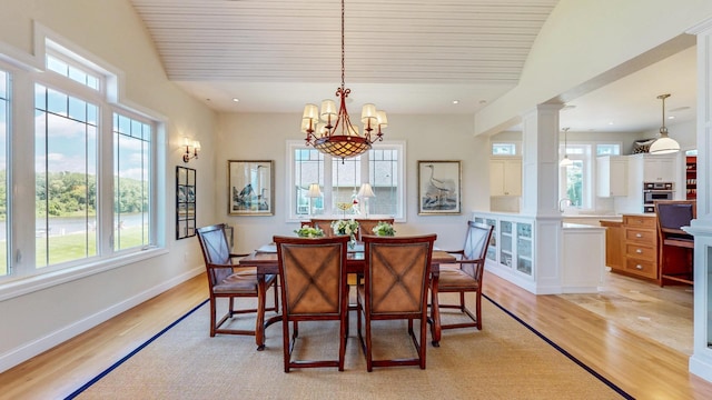 830 Prairie Island Rd N, Winona, MN 55987 - dining space featuring light wood-style flooring, wood ceiling, and a chandelier