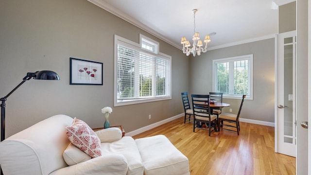 830 Prairie Island Rd N, Winona, MN 55987 - living room featuring a chandelier, crown molding, and light wood finished floors