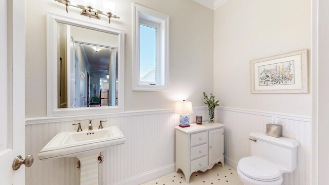 830 Prairie Island Rd N, Winona, MN 55987 - half bath with a wainscoted wall and tile patterned floors