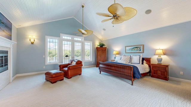 830 Prairie Island Rd N, Winona, MN 55987 - carpeted bedroom featuring a glass covered fireplace, ceiling fan, and high vaulted ceiling