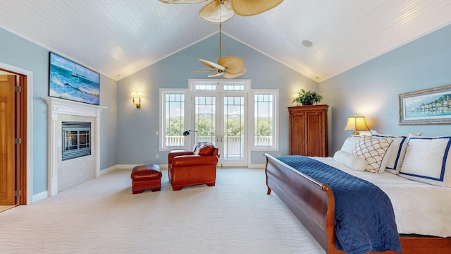 830 Prairie Island Rd N, Winona, MN 55987 - bedroom featuring access to exterior, a glass covered fireplace, carpet, and high vaulted ceiling
