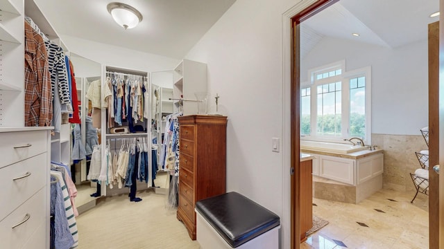 830 Prairie Island Rd N, Winona, MN 55987 - walk in closet featuring vaulted ceiling