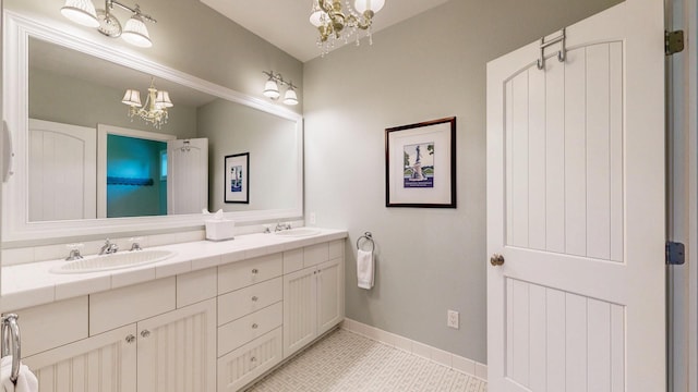 830 Prairie Island Rd N, Winona, MN 55987 - bathroom with a chandelier, double vanity, and tile patterned flooring