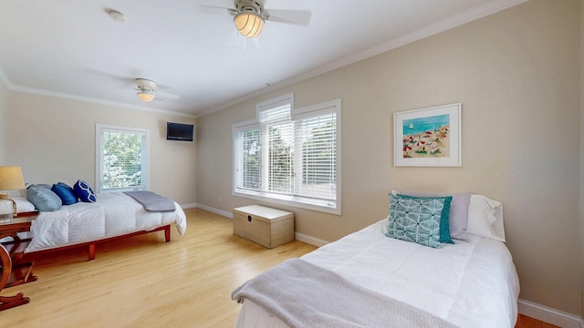 830 Prairie Island Rd N, Winona, MN 55987 - bedroom featuring crown molding, wood finished floors, and a ceiling fan