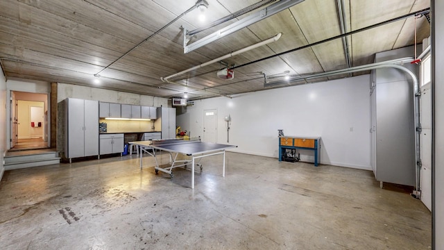 830 Prairie Island Rd N, Winona, MN 55987 - garage featuring a garage door opener and baseboards