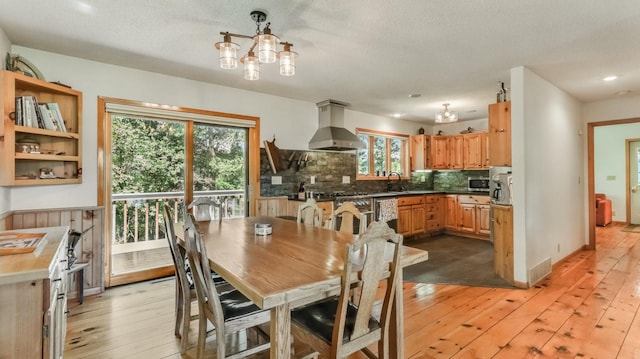 2756 7 5/8 Ave, Chetek, WI 54728 - dining room featuring light wood finished floors, a chandelier, a textured ceiling, and recessed lighting