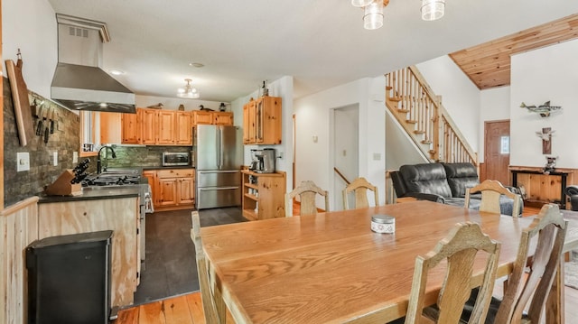 2756 7 5/8 Ave, Chetek, WI 54728 - dining room with stairway, dark wood-type flooring, and lofted ceiling