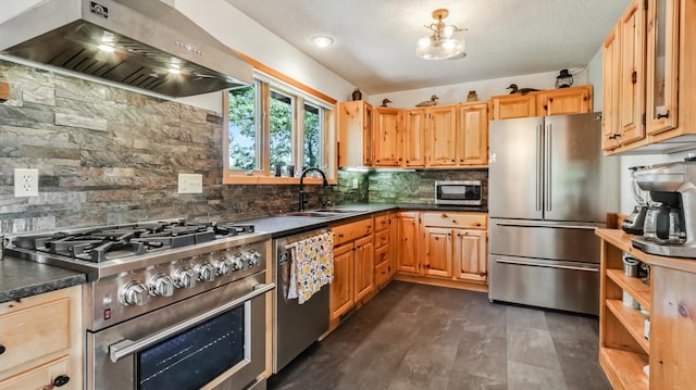 2756 7 5/8 Ave, Chetek, WI 54728 - kitchen with wall chimney range hood, stainless steel appliances, decorative backsplash, dark countertops, and light brown cabinetry