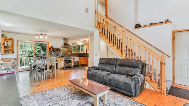 2756 7 5/8 Ave, Chetek, WI 54728 - living room with wood finished floors, stairs, and a chandelier