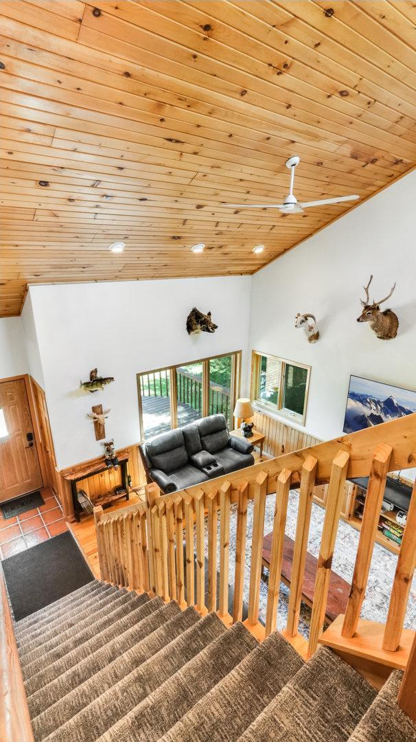 2756 7 5/8 Ave, Chetek, WI 54728 - stairs featuring healthy amount of natural light, lofted ceiling, wooden ceiling, recessed lighting, and tile patterned floors