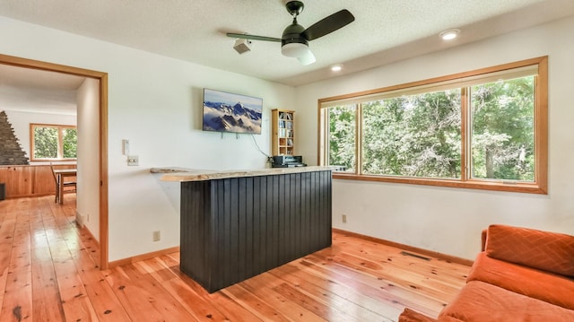 2756 7 5/8 Ave, Chetek, WI 54728 - office with light wood finished floors, a dry bar, and a ceiling fan