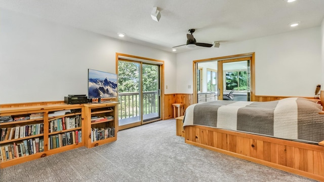 2756 7 5/8 Ave, Chetek, WI 54728 - bedroom featuring wainscoting, multiple windows, access to exterior, wood walls, and carpet