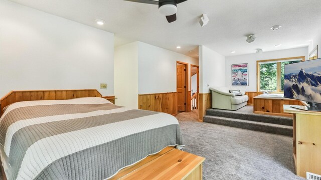 2756 7 5/8 Ave, Chetek, WI 54728 - bedroom featuring carpet flooring, wainscoting, wooden walls, ceiling fan, and recessed lighting