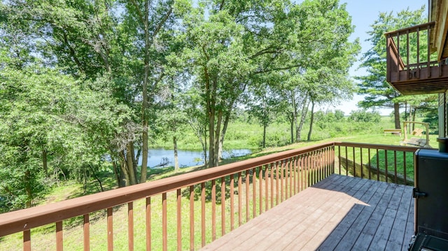 2756 7 5/8 Ave, Chetek, WI 54728 - wooden deck with a water view, a yard, and view of scattered trees