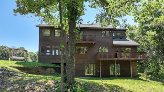 2756 7 5/8 Ave, Chetek, WI 54728 - rear view of property featuring a lawn and a deck