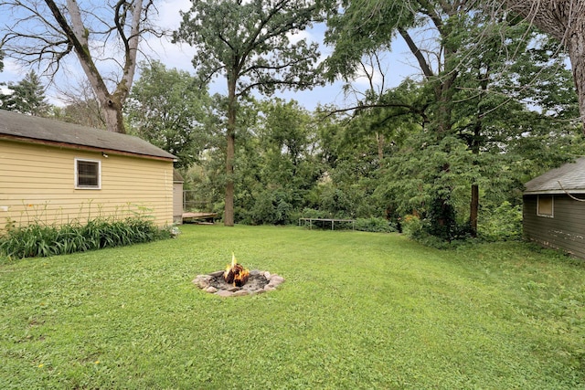 208 12th St SE, Austin, MN 55912 - view of grassy yard featuring a fire pit