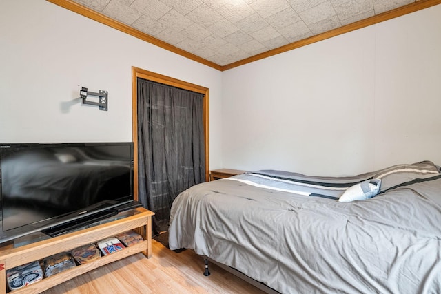 208 12th St SE, Austin, MN 55912 - bedroom with ornamental molding and wood finished floors
