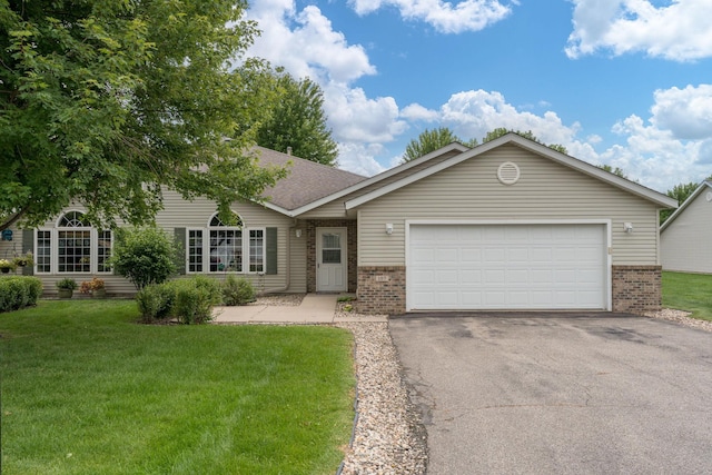 107 Oxford Path, Mankato, MN 56001 - single story home featuring brick siding, asphalt driveway, a front yard, and a garage