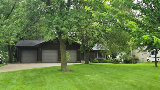 2145 Kenneth Dr, Albert Lea, MN 56007 - view of front of property featuring a garage, a front yard, and driveway
