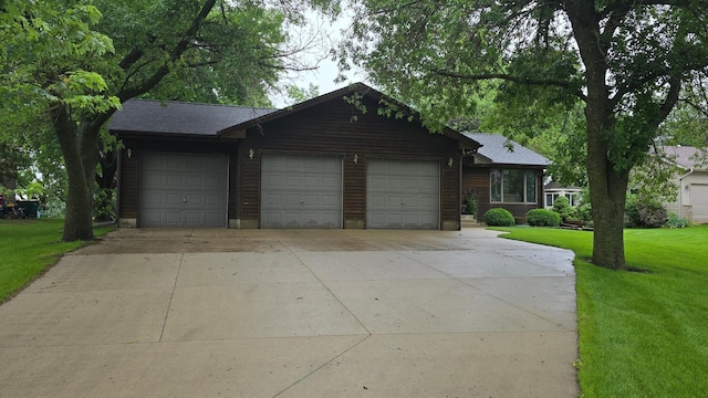 2145 Kenneth Dr, Albert Lea, MN 56007 - view of front of property with an attached garage, driveway, and a front lawn