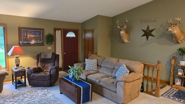 2145 Kenneth Dr, Albert Lea, MN 56007 - carpeted living area featuring healthy amount of natural light and vaulted ceiling