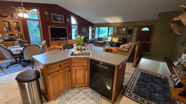 2145 Kenneth Dr, Albert Lea, MN 56007 - kitchen featuring black dishwasher, vaulted ceiling, light countertops, a ceiling fan, and brown cabinetry