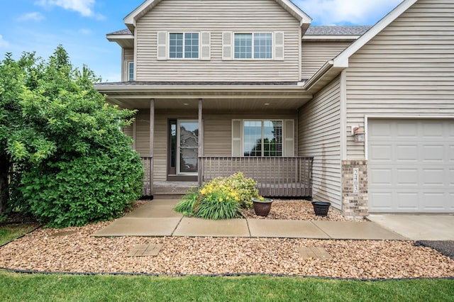 2403 Meadow Dr, Buffalo, MN 55313 - view of front of house featuring covered porch and a garage