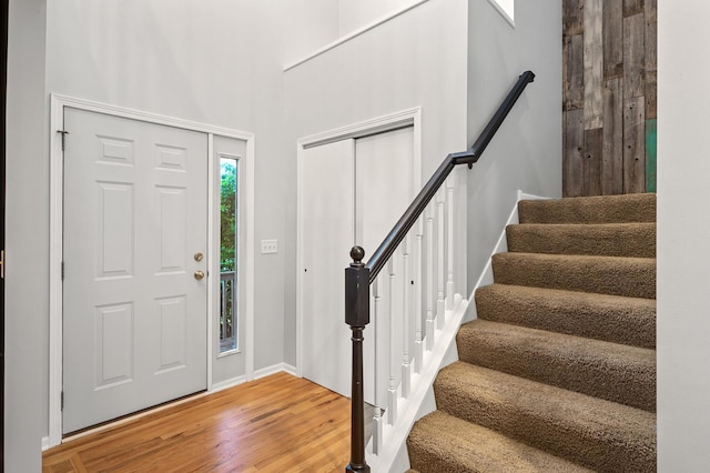 2403 Meadow Dr, Buffalo, MN 55313 - entrance foyer with stairway, light wood finished floors, and a high ceiling