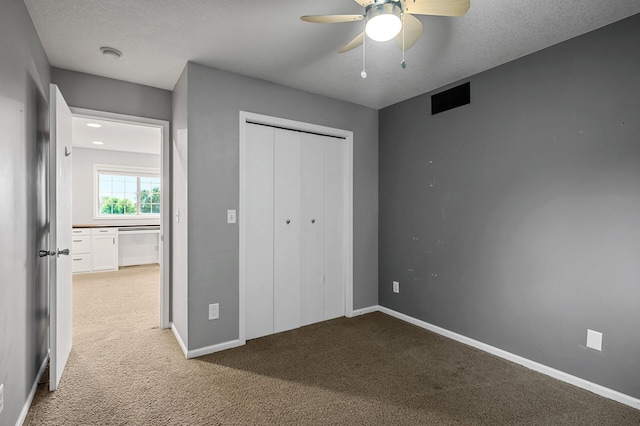 2403 Meadow Dr, Buffalo, MN 55313 - unfurnished bedroom featuring carpet floors, a closet, and ceiling fan