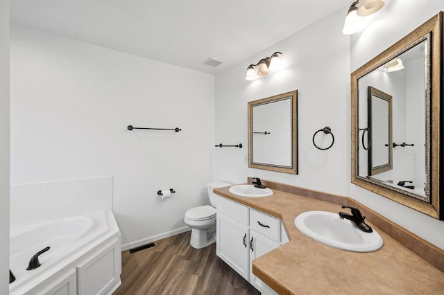 2403 Meadow Dr, Buffalo, MN 55313 - bathroom featuring double vanity, a bath, and wood finished floors
