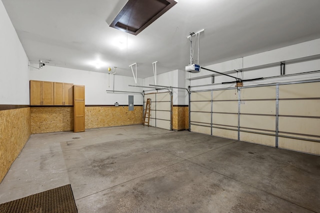 2403 Meadow Dr, Buffalo, MN 55313 - garage with electric panel, a wainscoted wall, and a garage door opener