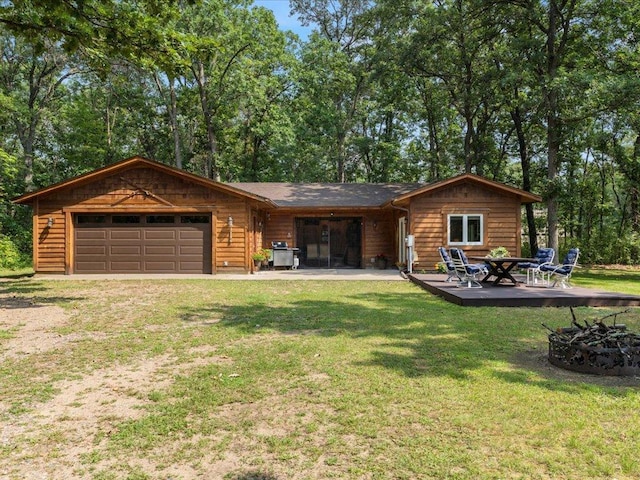 33638 Anderson Ct, Crosslake, MN 56442 - rear view of house with a yard, driveway, and a garage