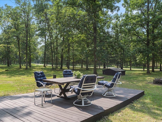 33638 Anderson Ct, Crosslake, MN 56442 - wooden deck with a yard, outdoor dining space, and view of scattered trees