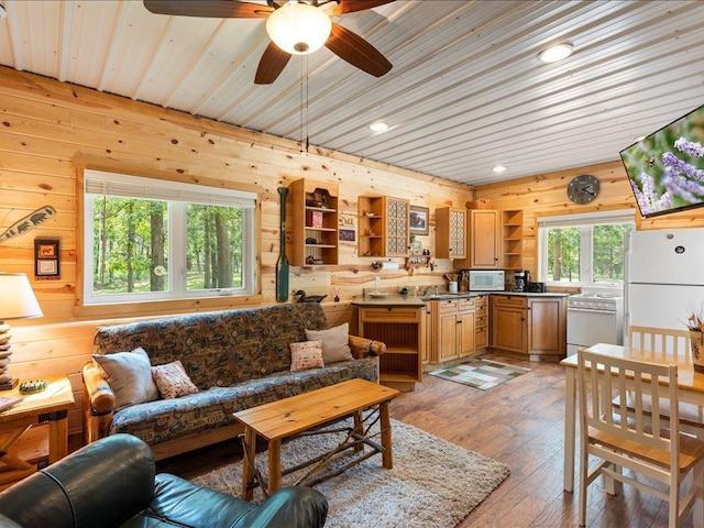 33638 Anderson Ct, Crosslake, MN 56442 - living room featuring wood walls, ceiling fan, light wood finished floors, recessed lighting, and wood ceiling