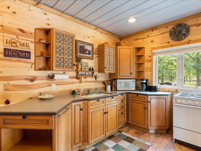 33638 Anderson Ct, Crosslake, MN 56442 - kitchen featuring open shelves, white appliances, wooden walls, light wood-style flooring, and brown cabinets