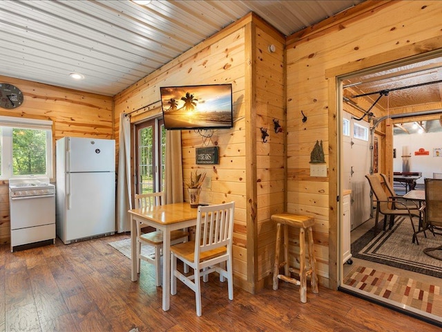 33638 Anderson Ct, Crosslake, MN 56442 - dining room featuring wood walls, wood-type flooring, plenty of natural light, and wood ceiling