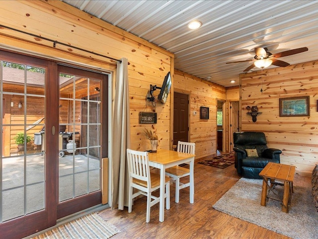 33638 Anderson Ct, Crosslake, MN 56442 - dining space featuring wood walls, ceiling fan, wood finished floors, and recessed lighting