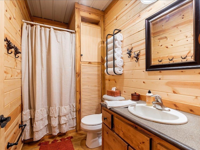33638 Anderson Ct, Crosslake, MN 56442 - full bathroom featuring wooden walls, vanity, wooden ceiling, and a shower with shower curtain