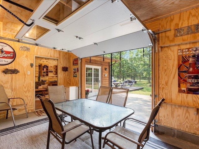 33638 Anderson Ct, Crosslake, MN 56442 - dining space with wood walls and carpet