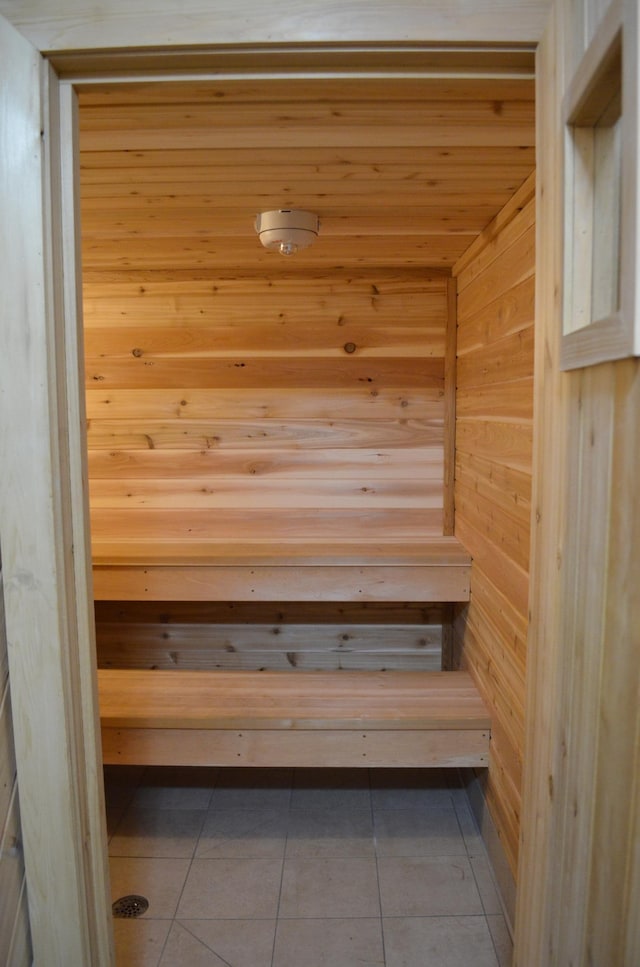 4387 Wilshire Blvd Unit 307, Mound, MN 55364 - relaxing sauna with tile patterned flooring and wood walls