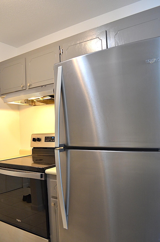 4387 Wilshire Blvd Unit 307, Mound, MN 55364 - kitchen with appliances with stainless steel finishes and under cabinet range hood