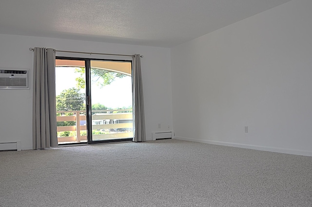 4387 Wilshire Blvd Unit 307, Mound, MN 55364 - carpeted empty room featuring a baseboard radiator, a wall unit AC, and a textured ceiling