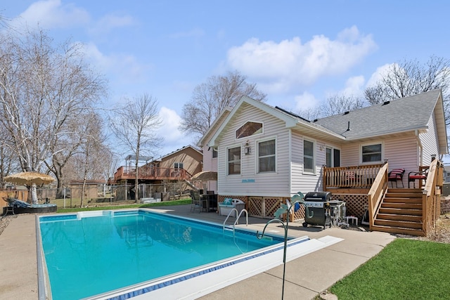 7175 Upper 157th St W, Apple Valley, MN 55124 - rear view of property featuring a deck, a patio, and a shingled roof