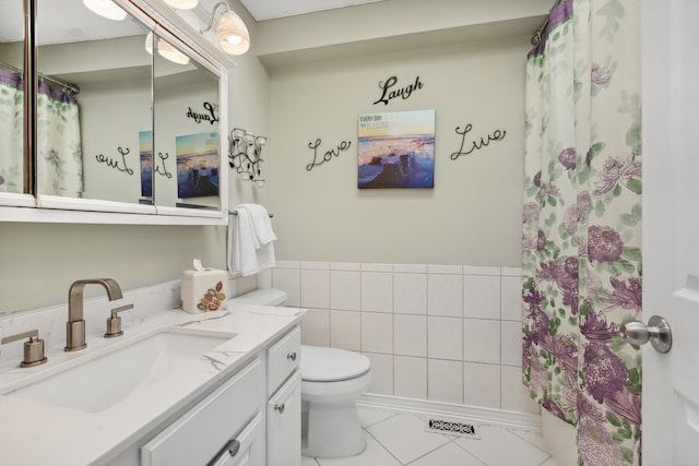 7175 Upper 157th St W, Apple Valley, MN 55124 - bathroom featuring vanity, tile patterned flooring, a shower with shower curtain, and tile walls