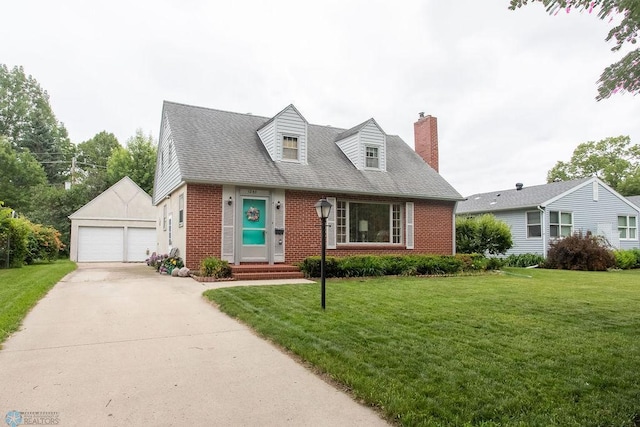 1245 1st St N, Fargo, ND 58102 - new england style home featuring brick siding, a detached garage, a chimney, an outbuilding, and a front lawn