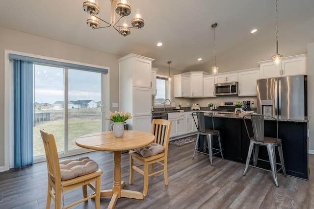 12 Kodiak Ct, North Mankato, MN 56003 - dining space with dark wood-style floors, a chandelier, and recessed lighting