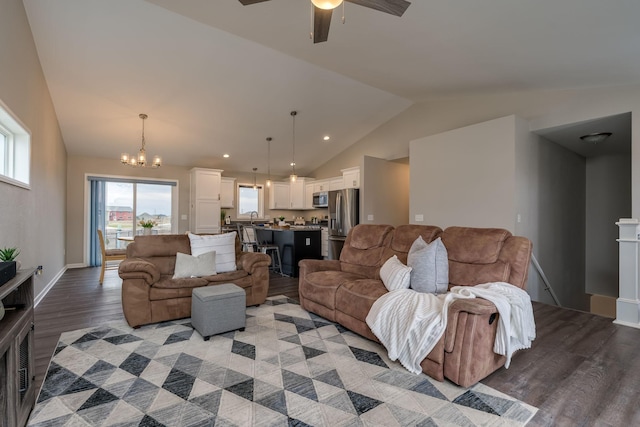 12 Kodiak Ct, North Mankato, MN 56003 - living room featuring vaulted ceiling, light wood-style floors, a chandelier, and a ceiling fan