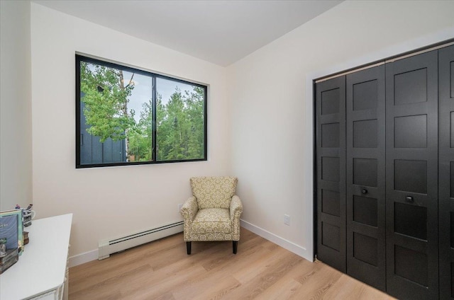 3733 London Rd Unit 15, Duluth, MN 55804 - sitting room with baseboard heating and light wood-type flooring