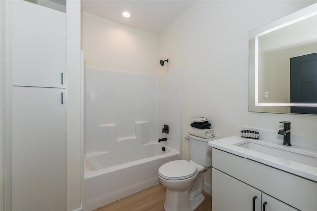 3733 London Rd Unit 15, Duluth, MN 55804 - full bath featuring vanity, tub / shower combination, and wood finished floors